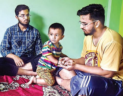 Twin brothers Mohammed Aslam and Mohammed Akram take turns to engage their elder brother Azam’s 18-month-old son, who asks for his father the first thing in the morning | vinay madapu