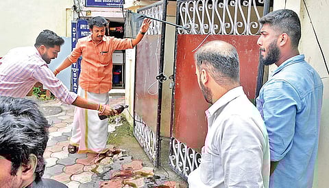 Yuva Morcha workers sprinkle black oil in front of Shashi Tharoor’s office in Thiruvananthapuram on Monday | B P Deepu