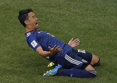 Japan's Shinji Kagawa celebrates scoring the opening goal during the group H match between Colombia and Japan at the 2018 soccer World Cup in the Mordavia Arena in Saransk, Russia, Tuesday, June 19, 2018. (Photo | AP)