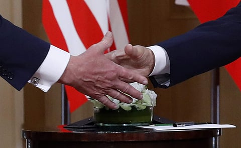 Trump and Putin shake hands at the Helsinki Summit (Photo |AP)