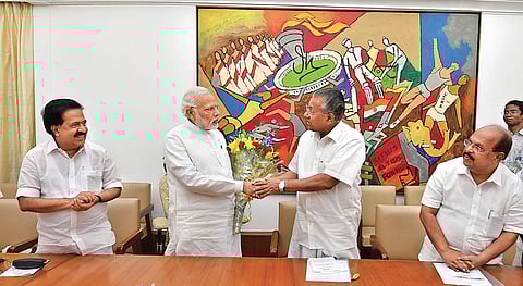 Chief Minister Pinarayi Vijayan greets Prime Minister Narendra Modi at Parliament House in New Delhi on Thursday | Express