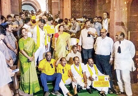 TDP MPs stage a protest at Parliament’s entrance gate demanding special status for AP in New Delhi on Friday | Express