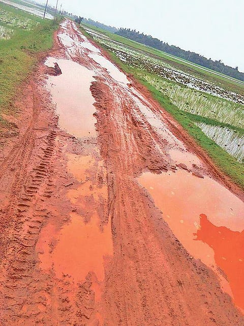 Trilochanpur-Dhinkia road that was damaged in rain I EXPRESS