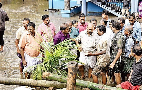 Agriculture Minister V S Sunil Kumar interacts with flood-affected people in Kuttanad | Express