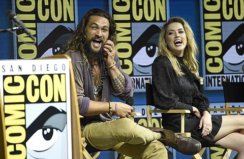 Jason Momoa, left, and Amber Heard attend the Warner Bros. Theatrical panel for 'Aquaman' on day three of Comic-Con International on Saturday. (Photo | AP)