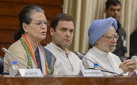 Former Congress president Sonia Gandhi speaks as party president Rahul Gandhi and former prime minister Manmohan Singh look on at the Extended Congress Working Committee CWC meeting in New Delhi. (Photo | PTI)