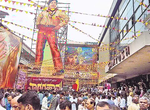 Huge cutout of actor Dr Vishnuvardhan outside Santosh theatre in Bengaluru I EXPRESS