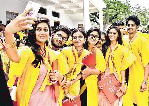 Students make time for a selfie after receiving their convocation certificates at the 27th Convocation of Sathyabama University on Sunday | ASHWIN PRASATH