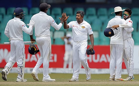 Sri Lanka's Rangana Herath, center, celebrates with teammates after their win over South Africa on the fourth day of their second test cricket match in Colombo, Sri Lanka. (Photo | AP)