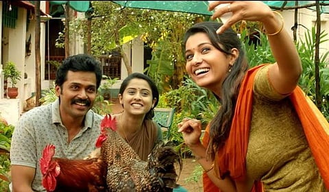 Karthi with Priya Bhavani Shankar (left) and Arthana Binu (right) in Kadaikutty Singam.