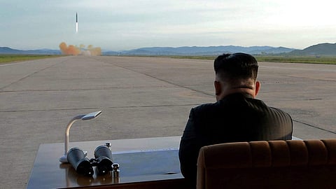 North Korea's King Jong Un watching a missile test. (Photo | KCNA)