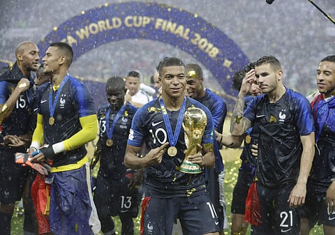 France's Kylian Mbappe celebrates with the trophy after the final match between France and Croatia at the 2018 soccer World Cup in the Luzhniki Stadium in Moscow, Russia. ( File Photo | AP)