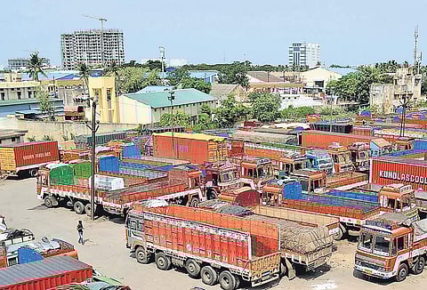 Lorries parked at the CMDA truck terminus following the nationwide strike in Chennai | Express