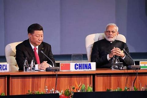 (LtoR) China's President Xi Jinping and India's Prime Minister Narendra Modi attend a session meeting during the 10th BRICS summit (acronym for the grouping of the world's leading emerging economies, namely Brazil, Russia, India, China and South Africa) o