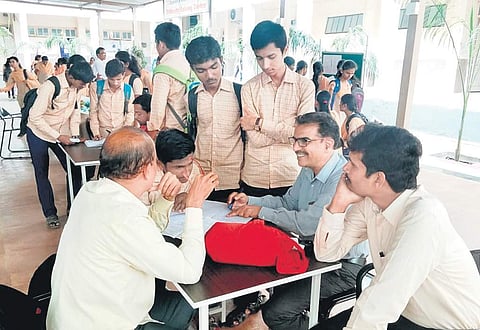 Students at Dayanand College consult their teachers at a special difficulty-solving session after regular classes | Express