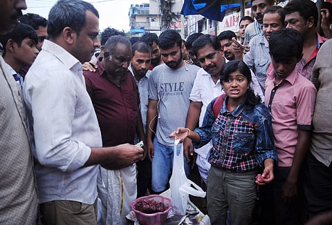 Hanan, a third year BSc Chemistry student, selling fish at Thammanam Junction on Thursday | A Sanesh