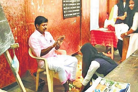 A student touching the feet of a teacher as part of the Guru Purnima celebrations at CNN Girls HSS at Cherpu. | Express Photo Services