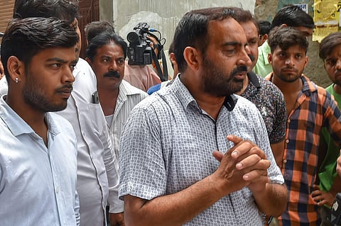 Relatives mourn after cremation of the 11 members of a family who were found hanging in their house in Burari at Nigambodh Ghat in New Delhi on Monday July 2 2018. | PTI