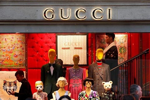 A Gucci sign is seen outside a shop in Paris. (File | Reuters)