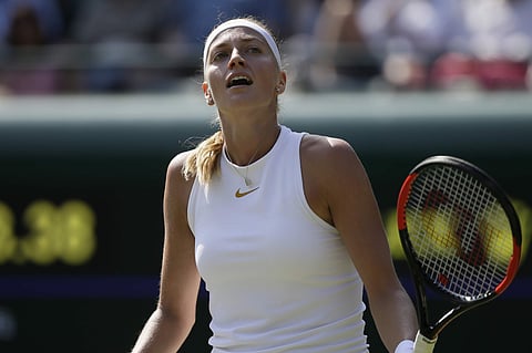Petra Kvitova loses a point to Aliaksandra Sasnovich during their women's singles match on the second day at the Wimbledon Tennis Championships in London. | AP