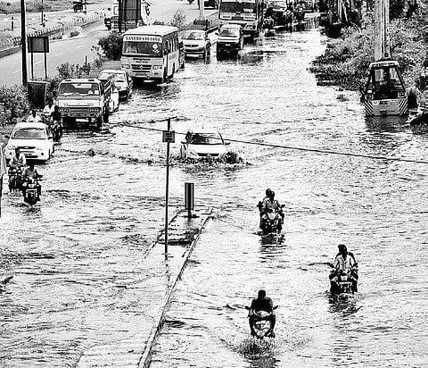 Motorists wade through an inundated road in Salem city as heavy rains lashed the region on Sunday night | Express
