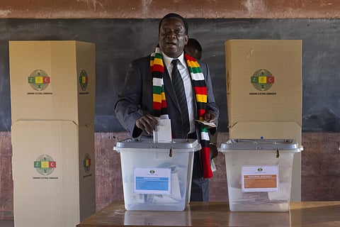 Zimbabwean President Emmerson Mnangagwa casts his vote for the presidential elections at the Sherwood Primary School in Kwekwe, Zimbabwe. (Photo | AP)