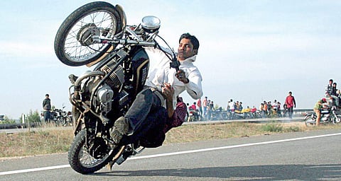 Bengalurean doing a wheelie in the city