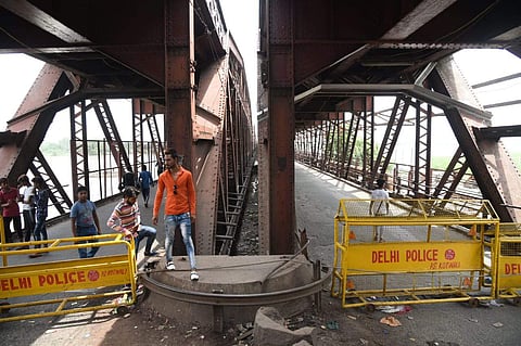 The old Yamuna bridge 'Loha Pul' has been temporary closed for rail traffic as water level has reached at 205.53 marks. (Parveen Negi | EPS)