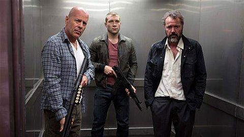 This publicity film image released by 20th Century Fox shows Bruce Willis as John McClane, left, Jai Courtney as his son Jack, center and Sebastian Koch as Komarov in a scene from 'A Good Day to Die Hard'. (Photo | AP)