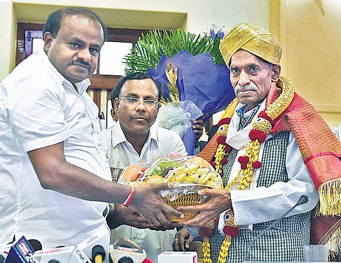 Subash being honoured by CM Kumaraswamy