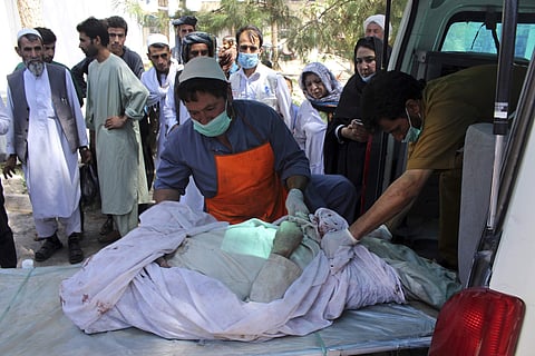 Medical personnel transport the body of a bombing victim by ambulance, at a hospital in Herat, Afghanistan, Tuesday, July 31, 2018. (Photo | AP)