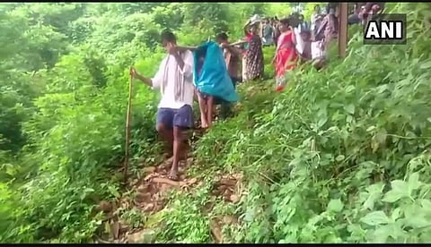 Pregnant Woman being carried on bamboo stretcher. (Photo | ANI)