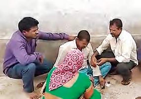 Srinu mourns the death of his wife and child Tuesday at his house |Express