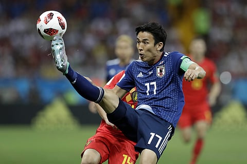 Japan's Makoto Hasebe challenges for the ball during the round of 16 match between Belgium and Japan at the 2018 soccer World Cup in the Rostov Arena, in Rostov-on-Don, Russia, Monday, July 2, 2018. | AP