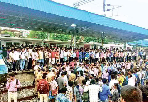 Rail passengers blocking a Chennai-bound train at Arakkonam on Tuesday | Express