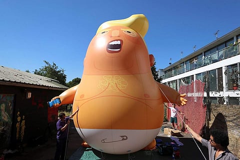 The orange ballon depicting Donald Trump in white nappies. (Photo: Twitter)