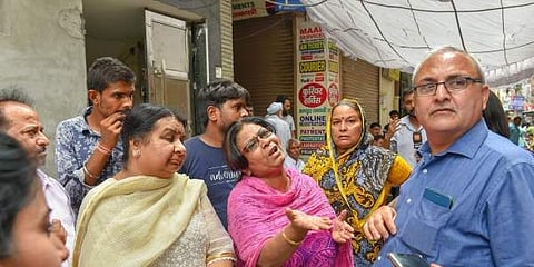 Grief-stricken relatives of the 11 members who allegedly committed suicide at their residence in Burari outside their house New Delhi. (File Photo | PTI)