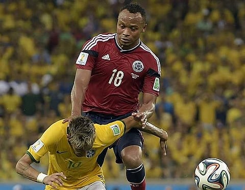 Brazil's Neymar is fouled by Colombia's Juan Camilo Zuniga during the 2014 World Cup quarterfinal soccer match between Brazil and Colombia. (File | AP)