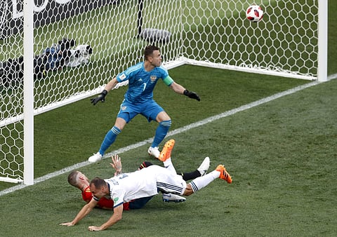 Russia's Sergei Ignashevich, front, scores an own goal during the round of 16 match between Spain and Russia. (Photo | AP)