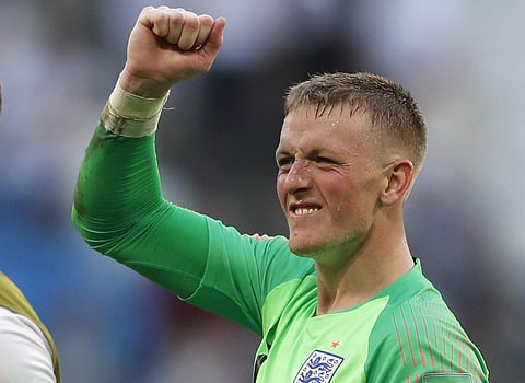 England goalkeeper Jordan Pickford celebrates victory of his team over Sweden during the quarterfinal match between Sweden and England at the 2018 soccer World Cup in the Samara Arena. | AP