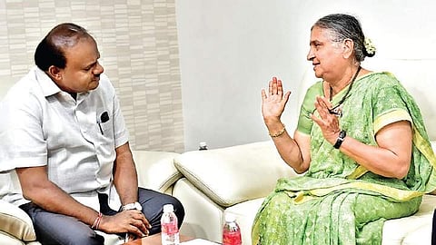 Chairperson of Infosys Foundation Sudha Murthy with Chief Minister H D Kumaraswamy at the latter’s home office Krishna, on Saturday