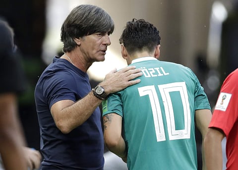 Germany head coach Joachim Loew, left, talks to Germany's Mesut Ozil (File photo | AP)