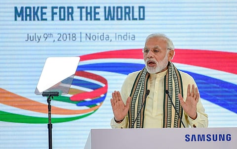 rime Minister Narendra Modi addresses at the inauguration ceremony of Samsung mobile factory in Noida on Monday. (Photo | PTI)