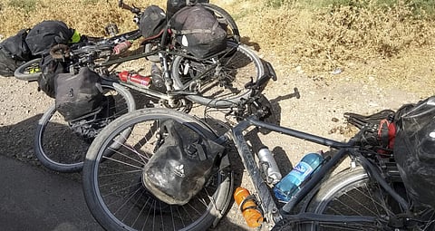 In this photo taken on Sunday, July 29, 2018, cycles are left where four tourists were killed when a car rammed into a group of foreigners on bicycles south of the capital of Dushanbe, Tajikistan. (Photo | AP)
