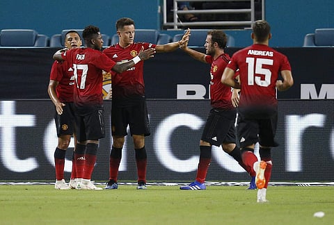 Manchester United midfielder Ander Herrera, third from left, celebrates his goal with teammates during the first half of the International Champions Cup tournament soccer match against Real Madrid. | AP