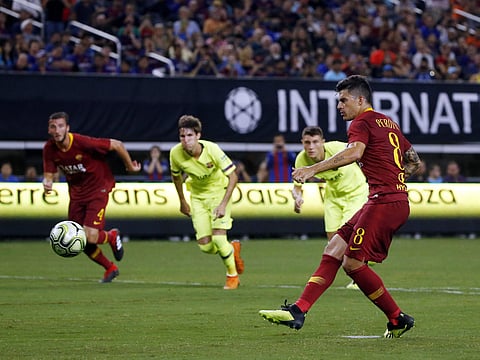 Roma forward Diego Perotti (8) scores on a penalty kick against Barcelona during the second half of an International Champions Cup | AP