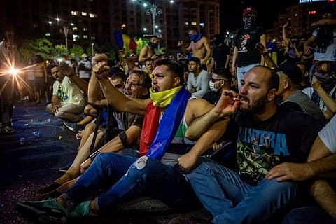 Romanian police used water cannon and tear gas to disperse anti-corruption protesters in Bucharest after tens of thousands rallied to call on the leftwing government to resign. Local media said between 50,000 to 80,000 people turned out for the protest, i