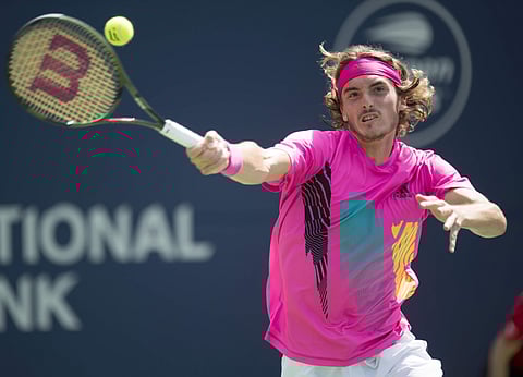 Stefanos Tsitsipas of Greece hits a forehand to Alexander Zverev of Germany during Rogers Cup quarterfinal tennis tournament action in Toronto on Friday, Aug. 10, 2018. | AP
