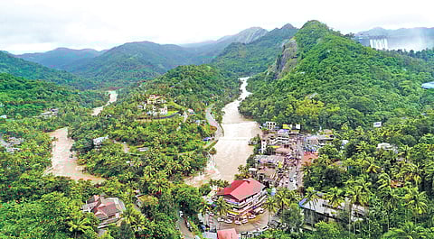 A drone shot of the water flowing downstream as all five shutters of the Cheruthoni dam were opened for the first time on Friday since the dam was commissioned in 1973 | Express