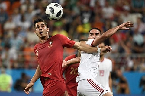 Portugal's forward Andre Silva (L) and Iran's defender Milad Mohammadi vie for the ball during the Russia 2018 World Cup Group B football match between Iran and Portugal at the Mordovia Arena in Saransk on June 25, 2018. | (File | AFP)